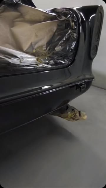Black bumper corner masked up in the workshop